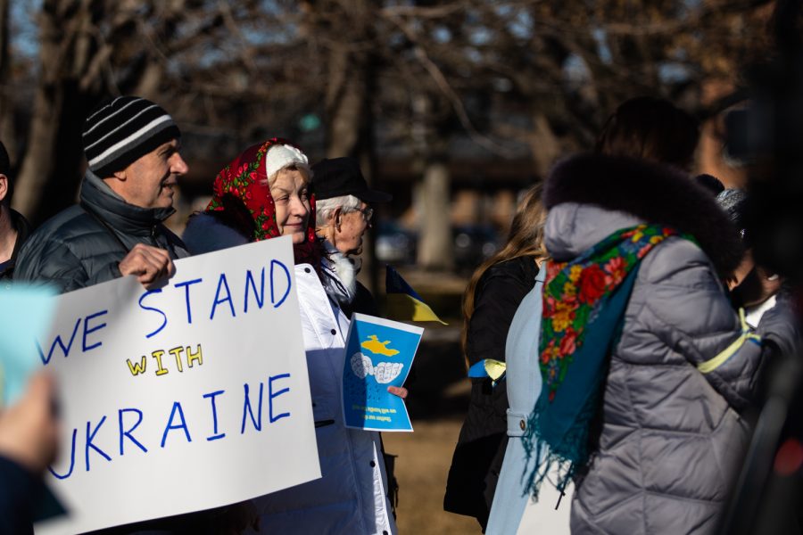 Demonstrators listen to speakers during a demonstration for peace in Ukraine on the Pentacrest at the University of Iowa in Iowa City. Around 60 people attended the demonstration. 