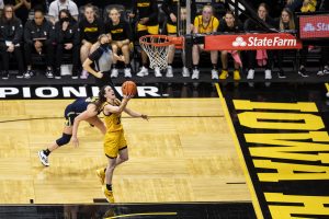 Iowa guard Caitlin Clark goes up for a shot during a women’s basketball game between No. 21 Iowa and No. 6 Michigan at Carver-Hawkeye Arena on Sunday, Feb. 27, 2022. Clark shot 11-of-18 in field goals. The Hawkeyes became regular season Big Ten co-Champions after defeating the Wolverines, 104-80.