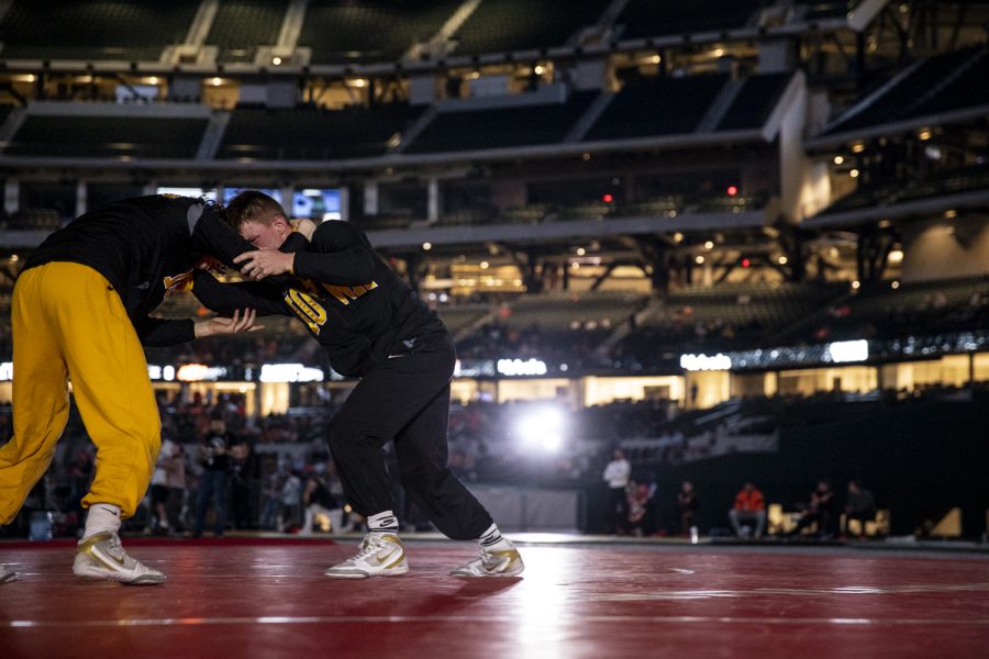 Iowa wrestlers Max Murin and Cobe Siebrecht warm up during the Bout at the Ballpark wrestling dual between No. 2 Iowa and No. 12 Oklahoma at Globe Life Field on Saturday, Feb. 12, 2022. Murin defeated Oklahoma States Kaden Gfeller 5-2 in decision.