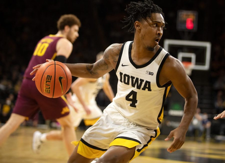 Iowa mens basketball guard Ahron Ulis dribbles the ball during a game against Minnesota on Feb. 6, 2022. The Hawkeyes beat the Golden Gophers, 71-59.