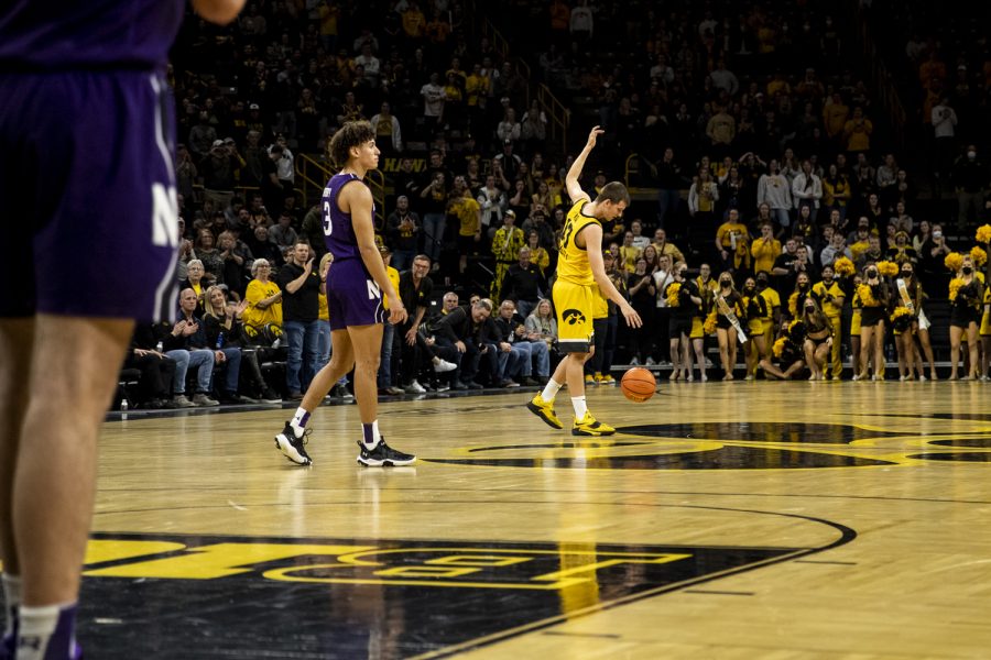 Iowa+guard+Austin+Ash+pumps+up+the+crowd+while+time+expires+during+a+men%E2%80%99s+basketball+game+between+No.+24+Iowa+and+Northwestern+in+Carver-Hawkeye+Arena+on+Monday%2C+Feb.+28%2C+2022.+The+senior+scored+three+points.+The+Hawkeyes+defeated+the+Wildcats%2C+82-61.