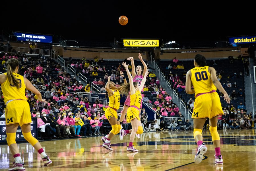 Iowa guard Caitlin Clark shoots a three-pointer during a women's basketball game between Iowa and Michigan at Crisler Center in Ann Arbor, Michigan, on Sunday, Feb. 6, 2022. Clark scored a career high 46 points. The Wolverines beat the Hawkeyes, 98-90.