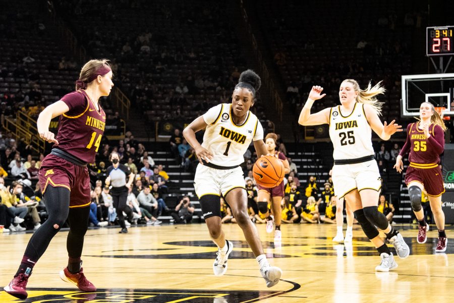 Iowa guard Tomi Taiwo drives the ball up the court during a basketball game between Iowa and Minnesota at Carver-Hawkeye Arena in Iowa City on Wednesday, Feb. 9, 2022. Taiwo earned 14 total points. The Hawkeyes beat the Golden Gophers 88-78.
