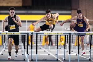 Iowa’s Austin West competes in the 60-meter hurdles during the 2022 Hawkeye Invitational track and field meet at the University of Iowa Recreation Building on Saturday, Jan. 15, 2022. West completed the race with a time of 8.20 seconds. The Hawkeye Invitational hosted Arkansas State, Bradley, Hawkeye Community College, Indian Hills Community College, Iowa Central Community College, Loyola-Chicago, Northern Iowa, South Dakota, UW-Milwaukee, and Western Illinois. 