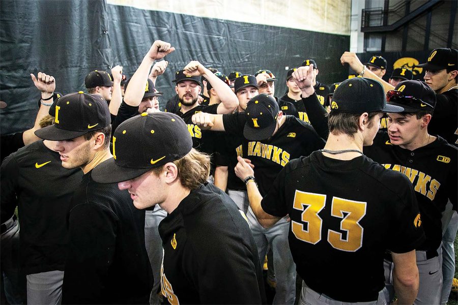 Iowa players huddle up during the Hawkeyes NCAA college baseball media day, Thursday, Feb. 10, 2022, at the University of Iowa Indoor Practice Facility in Iowa City, Iowa.