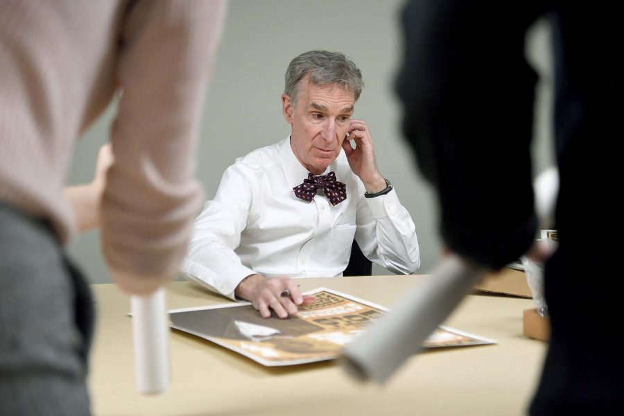 Bill Nye signs event posters for an after-show VIP meeting before Extreme Weather: A Conversation with Bill Nye at the U.S. Cellular Center on April 1, 2019. (Angeli Wright/awright@citizen-times.com)