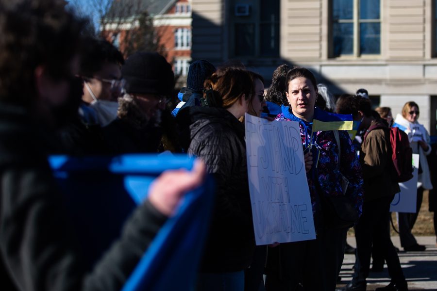 Demonstrators line up during a pro-Ukraine demonstration at the Pentacrest at the University of Iowa in Iowa City. Around 80 people attended the demonstration.