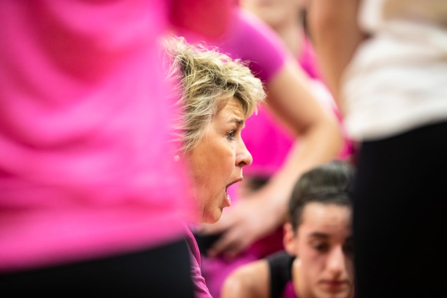 Iowa head coach Lisa Bluder talks to her team during a timeout at a basketball game between No. 22 Iowa and No. 13 Maryland at Carver-Hawkeye Arena in Iowa City on Monday, Feb. 14, 2022. The Terrapins beat the Hawkeyes 81-69.