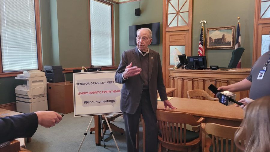 Sen. Chuck Grassley speaks to reporters at a town hall meeting in Albia, Iowa on Thursday, Feb. 24, 2022.