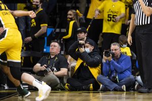 Dennis Scheidt, a freelance photographer for Hawkeye Report, takes photos during a men’s basketball game between Iowa and Michigan State at Carver-Hawkeye Arena on Tuesday, Feb. 22, 2022. The Hawkeyes defeated the Spartans, 86-60.