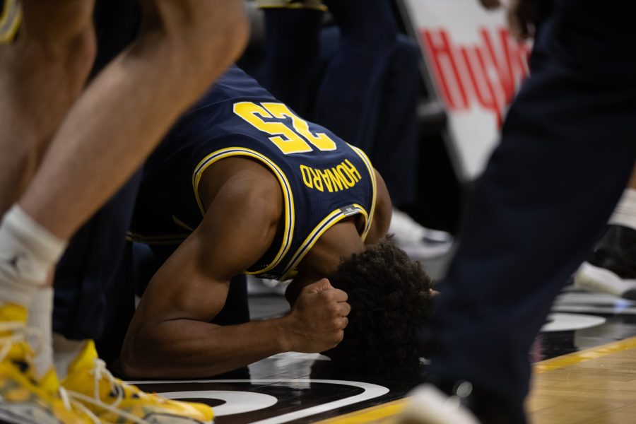 Michigan guard Jace Howard pounds the floor after the final buzzer during a men’s basketball game between Iowa and Michigan at Carver-Hawkeye Arena on Thursday, Feb. 18, 2022. Michigan improved to 14-10 following the game. The Wolverines defeated the Hawkeyes, 84-79.