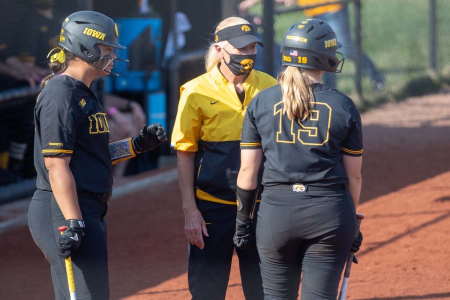 Iowa head coach Renee Gillispie talks with her players during a softball game between Iowa and Indiana at Pearl Field on Saturday, April 3, 2021. The Hawkeyes defeated the Hoosiers 1-0. 