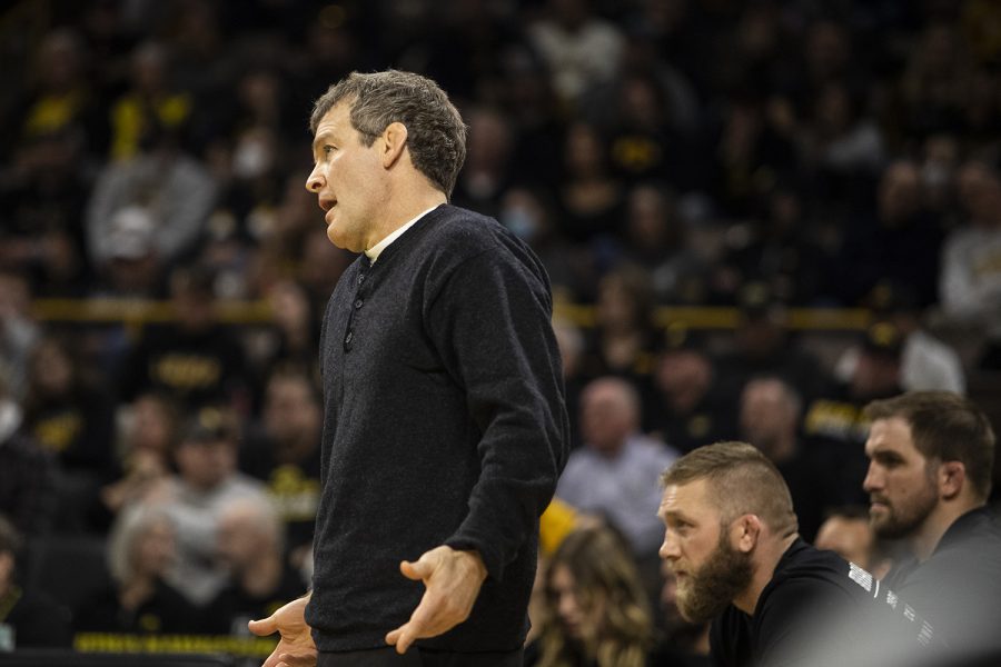 Iowa head coach Tom brands yells to the mat during a wrestling meet between No. 2 Iowa and No. 9 Wisconsin in Carver-Hawkeye Arena on Saturday, Feb. 5, 2022. The Hawkeyes defeated the Badgers, 29-6. 
