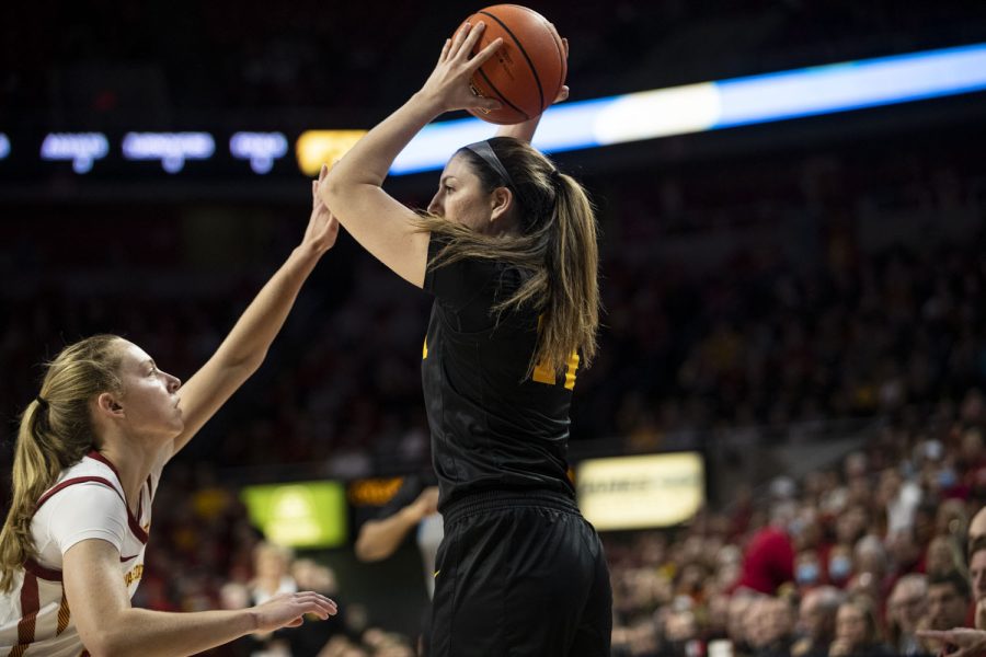 Iowa forward McKenna Warnock looks to pass during a women’s basketball game between No. 12 Iowa and No. 15 Iowa State at Hilton Coliseum in Ames, Iowa, on Wednesday, Dec. 8, 2021. Warnock had three assists. The Cyclones defeated the Hawkeyes 77-70. 