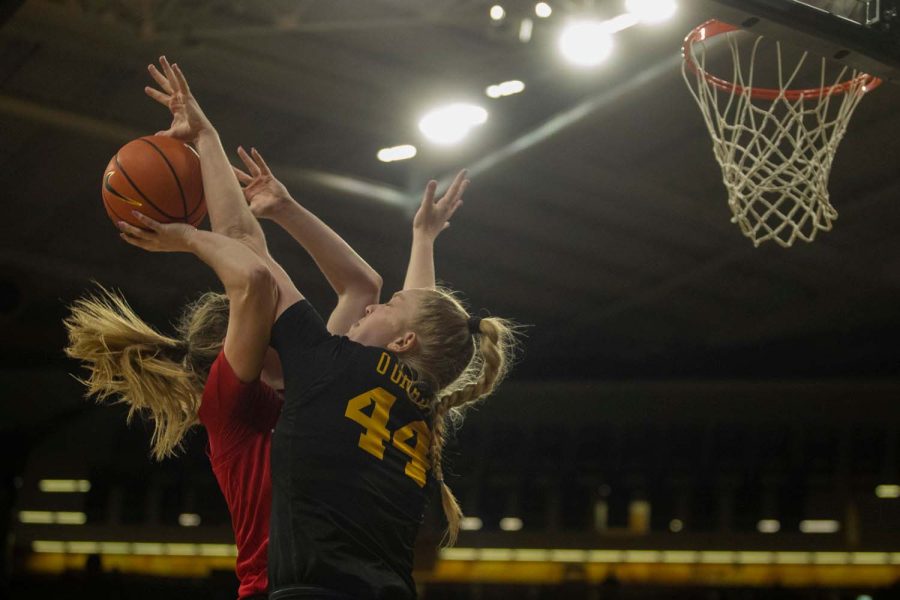 Iowa Forward Addison O-Grady fouls Nebraska guard Kendall Moriarty during a women’s basketball game between Iowa and Nebraska at Carver-Hawkeye Arena in Iowa City on Sunday, Jan. 16, 2022. The Hawkeyes defeated the Huskers, 93-83. 
