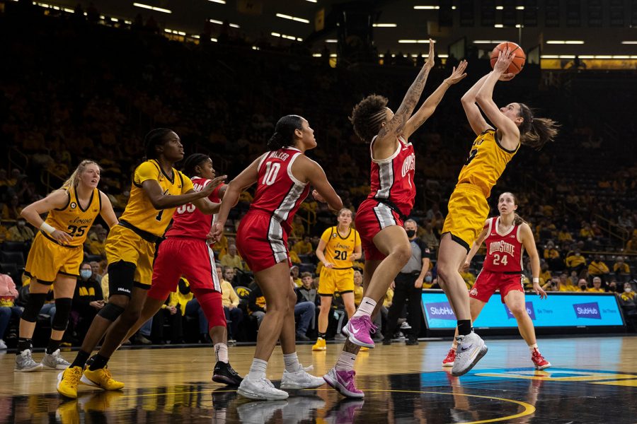 Iowa guard Caitlin Clark shoots a ball during a women’s basketball game between No. 21 Iowa and No. 23 Ohio State at Carver-Hawkeye Arena in Iowa City on Monday, Jan. 31, 2022. Clark scored a career-high 43 points. The Buckeyes defeated the Hawkeyes, 92-88.