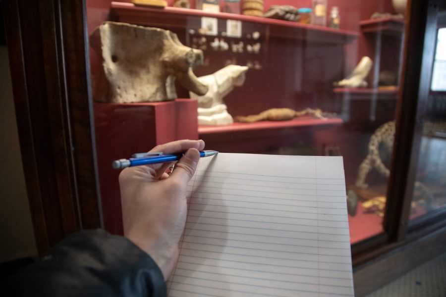 A pencil and a notebook are seen at the Museum of Natural History in Macbride Hall on Feb. 17 2022.
