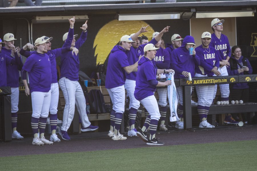 Loras’ bench celebrates during a baseball game between Iowa and Loras College at Duane Banks Field in Iowa City on Tuesday, March 1, 2022. The Duhawks defeated the Hawkeyes, 3-1.