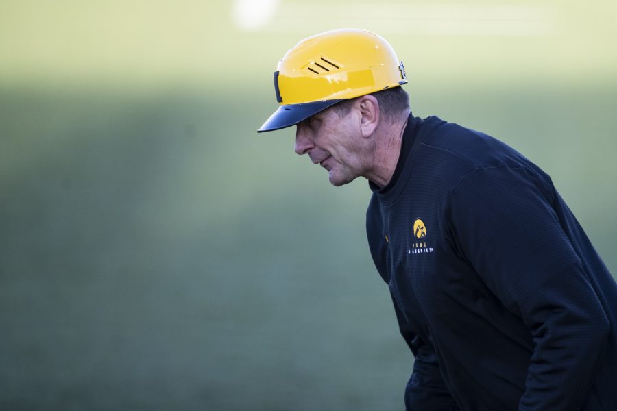 Iowa head coach Rick Heller jogs out of the dugout during a baseball game between Iowa and Loras College at Duane Banks Field in Iowa City on Tuesday, March 1, 2022. Heller’s Hawkeyes entered the game on a two game losing skid. The Duhawks defeated the Hawkeyes, 3-1.