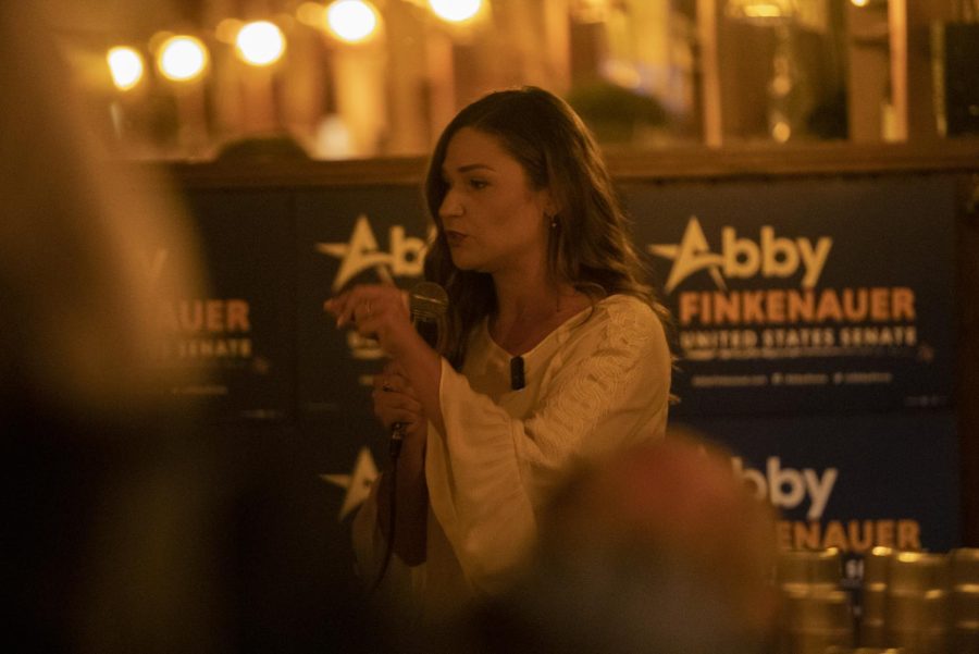 Abby Finkenauer gives a speech at a campaign meet and greet at Sanctuary in Iowa City on Thursday, Mar. 3, 2022. Finkenauer went after Sen. Chuck Grassley for being in the senate for too long, saying “47 years in Washington DC is too damn long for anyone.”