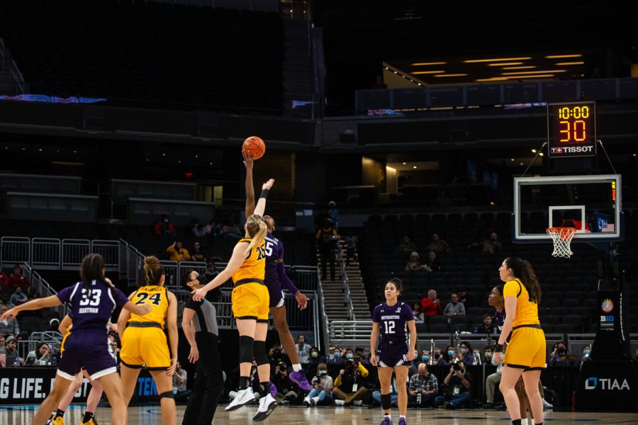 Iowa center Monika Czinano and Northwestern forward Courtney Shaw tip off at the beginning of a basketball game between No. 2 Iowa and No. 7 Northwestern during the Big Ten Womens Basketball Tournament at Gainbridge Fieldhouse in Indianapolis, IN, on Friday, March 4, 2022. The Hawkeyes beat the Wildcats, 72-59.