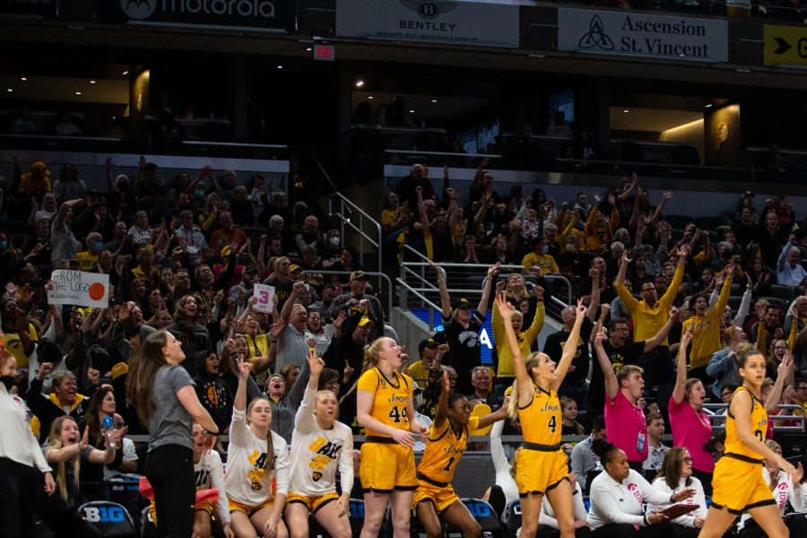 The Iowa sideline and fan section react after an Iowa score during a basketball game between No. 2 Iowa and No. 6 Nebraska during the Big Ten Womens Basketball Tournament at Gainbridge Fieldhouse in Indianapolis, IN, on Saturday, March 5, 2022. The Hawkeyes beat the Cornhuskers 83-66.