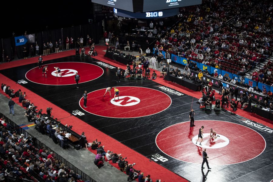 Three mats feature wrestlings during session one of the Big Ten Wrestling Championships at Pinnacle Bank Arena in Lincoln, Neb., on Saturday, March 5, 2022. After session one, Michigan leads with 68.5 points.