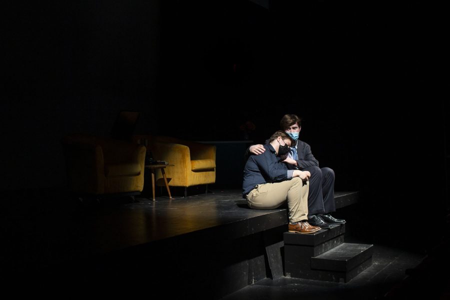 Paul, played by John Orlet, and Sidney, played by Grason Block, hug during a dress rehearsal of “I Saw You/New Person” at MacVey Theatre in the University of Iowa’s Theatre Building on Wednesday, March 9, 2022. “I Saw You/New Person,” which explores sexuality and identity in a 1950s trope-filled world, will perform in front of an audience on Friday, March 11, and Saturday, March 12.