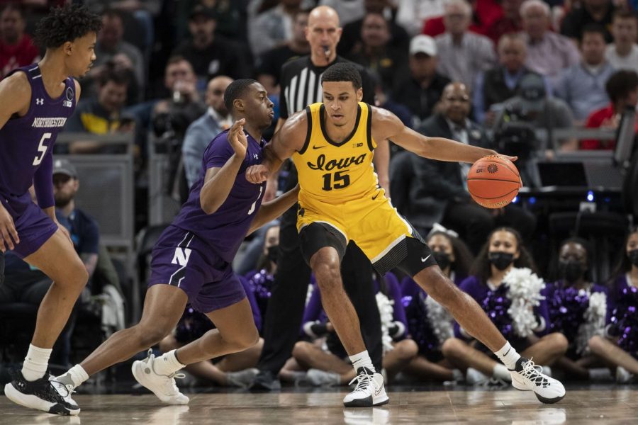 Iowa mens basketball forward Keegan Murray backs down a Northwestern player during the first half of a Big Ten Tournament game at Gainbridge Fieldhouse in Indianapolis on March 10, 2022.