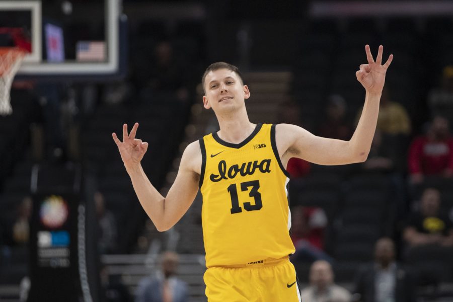 Iowa guard Austin Ash celebrates a 3-pointer during a men’s basketball game between No. 5 Iowa and No. 12 Northwestern in the Big Ten Basketball Tournament at Gainbridge Fieldhouse in Indianapolis on Thursday, March 10, 2022. The Hawkeyes defeated the Wildcats, 112-76. Ash scored 5 points.