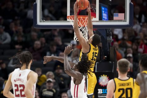 Iowa forward Keegan Murray dunks a ball during a men’s basketball game between No. 5 Iowa and No. 4 Rutgers in the Big Ten Basketball Tournament quarterfinals at Gainbridge Fieldhouse in Indianapolis on Friday, March 11, 2022. The Hawkeyes defeated the Scarlet Knights, 84-74. Murray finished with 26 points, becoming Iowa’s record holder for single-season scoring. 
