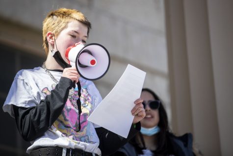 Seventh-grader Ace Drumbarger speaks during a transgender rights protest at the Pentacrest on Friday, March 11, 2022. Drumbarger spoke about their experiences being transgender and wanting to compete in sports. “Being transgender has nothing to do with capability of athletes.”