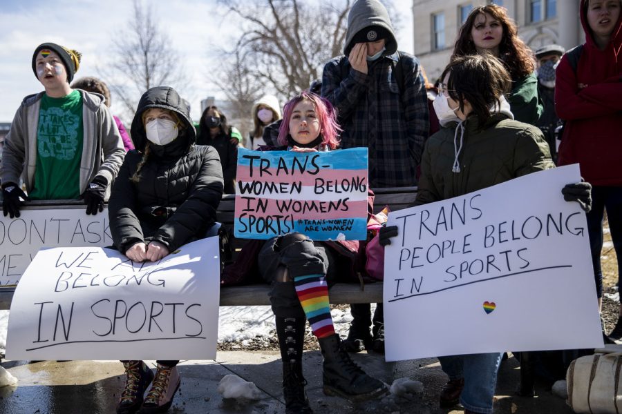 Attendees listen to a speaker during a transgender rights protest at the Pentacrest on March 11, 2022. Over 150 attendees demonstrated.