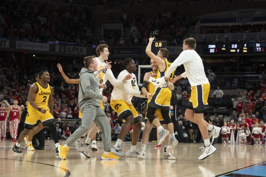 Iowa point guard Jordan Bohannon celebrates with teammates after hitting a game-winning 3-pointer in the Big Ten Tournament semifinals against Indiana at Gainbridge Fieldhouse in Indianapolis on March 12, 2022.