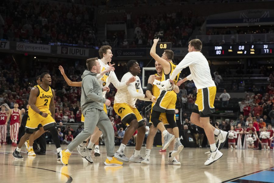 Iowa guard Jordan Bohannon celebrates with teammates during a men’s basketball game between No. 5 Iowa and No. 9 Indiana in the Big Ten Basketball Tournament Semifinals at Gainbridge Fieldhouse in Indianapolis on Saturday, March 12, 2022. Bohannon scored 12 points, shooting a 3-pointer in the final seconds of the game to put Iowa in the lead.  The Hawkeyes defeated the Hoosiers, 80-77.
