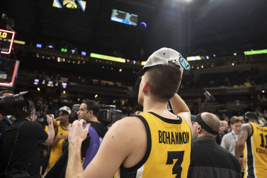 Iowa guard Jordan Bohannon puts on a Big Ten Tournament Champion hat during a men’s basketball game between No. 5 Iowa and No. 3 Purdue in the Big Ten Basketball Tournament Championship at Gainbridge Fieldhouse in Indianapolis on Sunday, March 13, 2022. The Hawkeyes defeated the Boilermakers, 75-66. Bohannon scored 7 points. (Dimia Burrell/The Daily Iowan)