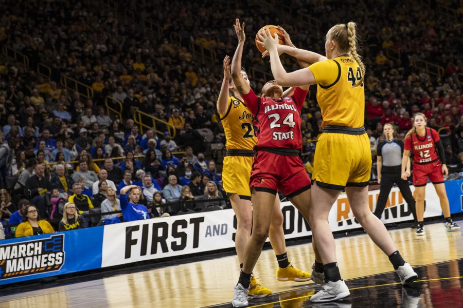 Illinois State forward DeAnna Wilson attempts to go up for a shot during a First Round NCAA women’s basketball tournament game against No. 2 Iowa and No. 15 Illinois State in sold-out Carver-Hawkeye Arena on Friday, March 18, 2022. Wilson shot 3-of-7 in field goals. The Hawkeyes defeated the Redbirds, 98-58, advancing themselves to the second round of the tournament.