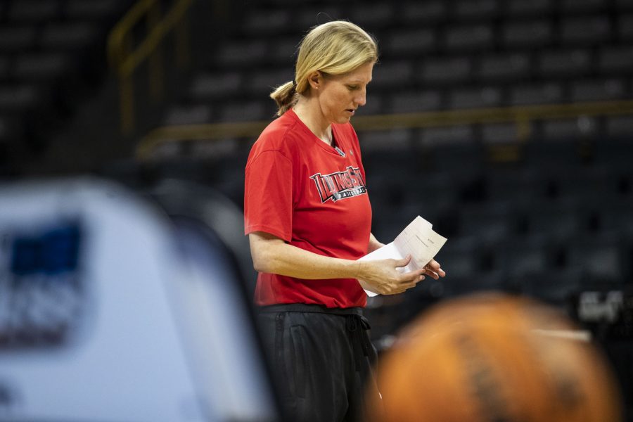 Illinois State head coach Kristen Gillespie observes a piece of paper during the 2022 NCAA First Round women’s basketball pre-game press conferences and open practices at Carver-Hawkeye Arena on Thursday, March 17, 2022. Gillespie said the Redbirds are here to win, but also to enjoy the experience. “We are here to try to win, and that is all our intention is to do everything we can to win tomorrow,” Gillespie said, “but I want to make sure that our players enjoy every second of this too.”
