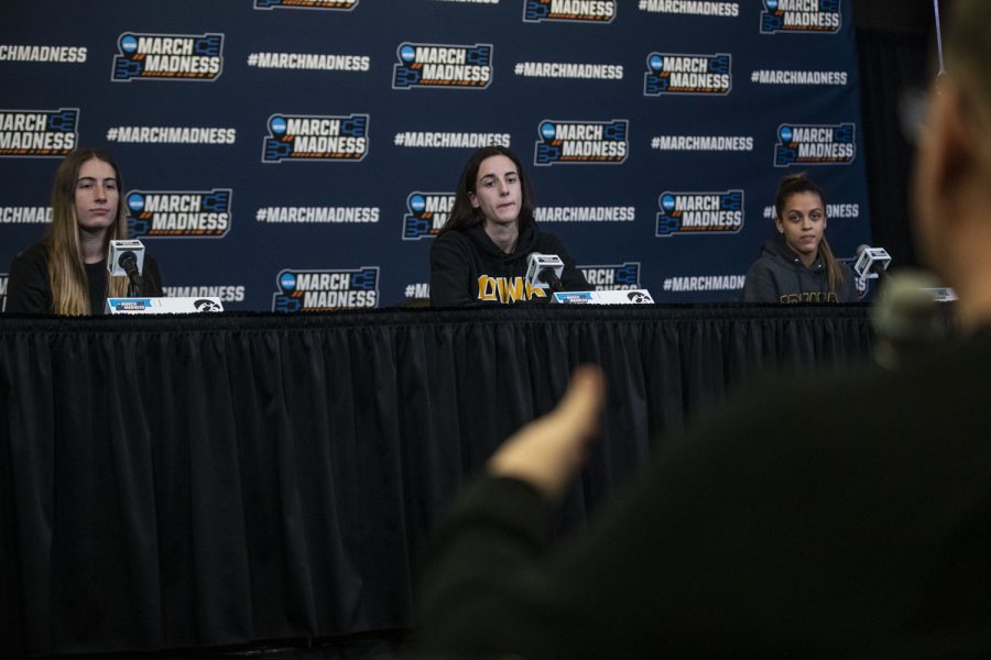 Iowa guards Kate Martin, Caitlin Clark, and Gabbie Marshall listen to a question during the 2022 NCAA Second Round women’s basketball pre-game press conferences for No. 2 Iowa and No. 10 Creighton at Carver-Hawkeye Arena on Saturday, March 19, 2022. Clark said playing Creighton in previous scrimmages is an advantage going into the matchup tomorrow, but both teams have improved their games. “were a completely different team than we were then,” Clark said, “having a lot more games under our belt.”