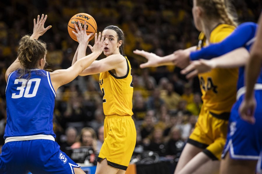Iowa guard Caitlin Clark looks to pass during a 2022 NCAA Second Round women’s basketball game between No. 2 Iowa and No. 10 Creighton in sold-out Carver-Hawkeye Arena on Sunday, March 20, 2022. Clark had 11 assists. The Bluejays defeated the Hawkeyes, 64-62, advancing to the Sweet 16 for the first time in program history.