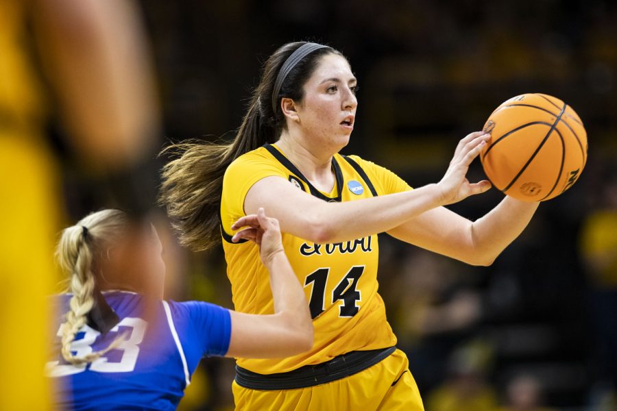 Iowa forward McKenna Warnock passes the ball during a 2022 NCAA Second Round women’s basketball game between No. 2 Iowa and No. 10 Creighton in sold-out Carver-Hawkeye Arena on Sunday, March 20, 2022. Warnock had four assists. The Bluejays defeated the Hawkeyes, 64-62, advancing to the Sweet 16 for the first time in program history.