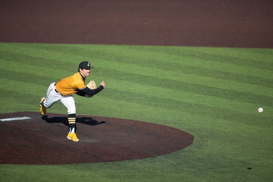 Iowa relief pitcher Jacob Henderson throws a pitch during a baseball game between Iowa and Central Michigan at Duane Banks Field on Sunday, March 27, 2022. Henderson finished the game with two strikeouts and a save. The Hawkeyes defeated the Chippewas 4-2.