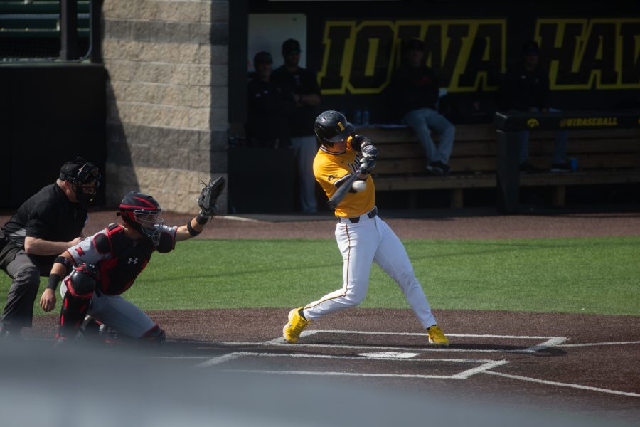 Iowa pinch hitter Sam Peterson hits a ball during a baseball game between Iowa and Texas Tech at Duane Banks Field on Sunday, March 20, 2022. The Hawkeyes defeated the Red Raiders 6-3. 