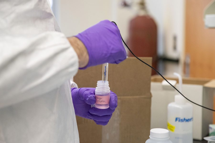 IIHR-Hyrdroscience and Engineering Assistant Research Scientist Drew Latta tests pH levels in water in the Seamans Center on Tuesday, March 29, 2022. Latta is part of a group that is developing an online tool that identifies which homes might be at risk of water contamination from lead. 