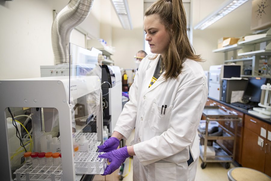 Graduate Research Assistant in the department of civil and environmental engineering Danielle Land loads a tray for an Inductively Coupled Plasma Mass Spectrometer (ICP-MS) in the Seamans Center on Tuesday, March 29, 2022. Land is part of a group that is developing an online tool that identifies which homes might be at risk of water contamination from lead. 