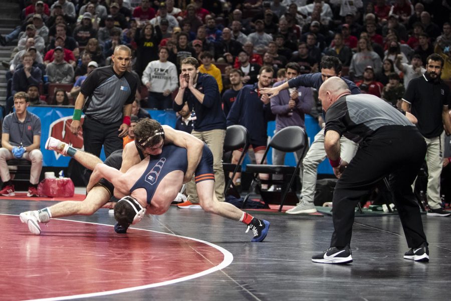 Iowa’s No. 2 Austin DeSanto takes down Illinois’ No. 3 Lucas Byrd  during session two of the Big Ten Wrestling Championships at Pinnacle Bank Arena in Lincoln, Neb., on Saturday, March 5, 2022. DeSanto defeated Byrd in a 133-pound match, 4-3.