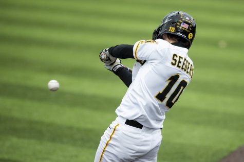 Iowa shortstop Michael Seegers puts the ball on the ground during a baseball game between Iowa and Central Michigan at Duane Banks Field in Iowa City on Friday, March 25, 2022. Seegers collected two hits and scored one run. The Hawkeyes defeated the Chippewas, 7-4.