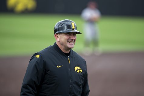 Iowa head coach Rick Heller smiles during a baseball game between Iowa and Central Michigan at Duane Banks Field in Iowa City on Friday, March 25, 2022. The Hawkeyes defeated the Chippewas, 7-4.