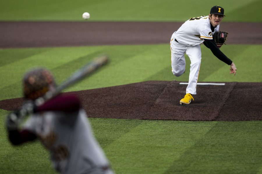 Iowa starting pitcher Adam Mazur throws a pitch during a baseball game between Iowa and Central Michigan at Duane Banks Field in Iowa City on Friday, March 25, 2022. Mazur went five innings and struck out five batters. The Hawkeyes defeated the Chippewas, 7-4.