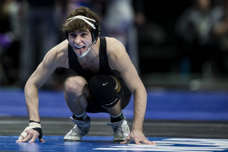 Iowas+No.+5+Austin+DeSanto+sticks+his+tongue+out+before+a+match+with+Virginia+Techs+No.+4+Korbin+Myers+during+session+three+at+the+NCAA+Wrestling+Championships+at+Little+Caesars+Arena+in+Detroit%2C+Mich.%2C+on+Friday%2C+March+18%2C+2022.+DeSatno+defeated+Myers+by+major+decision+in+a+133-pound+match%2C+9-0.+DeSanto+advances+to+the+semifinals+to+face+Penn+States+No.+1+Roman+Bravo-Young.